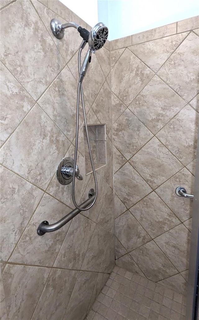 details with a tile shower