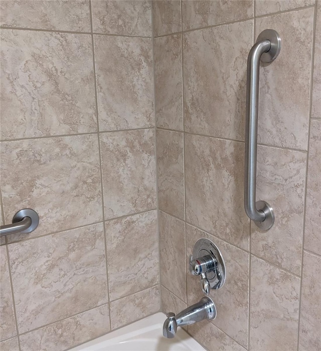 details with tiled shower / bath combo