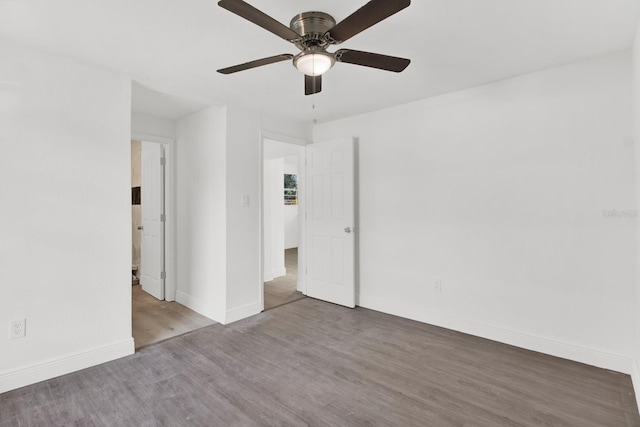 spare room featuring hardwood / wood-style floors and ceiling fan