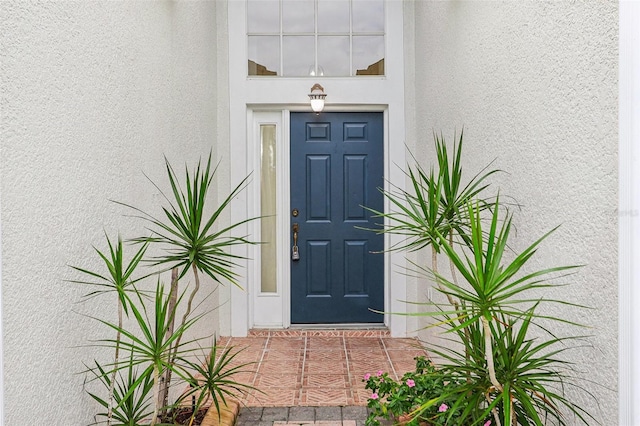 235 Royal Palm Dr, Davenport, FL 33837 - entrance to property featuring stucco siding