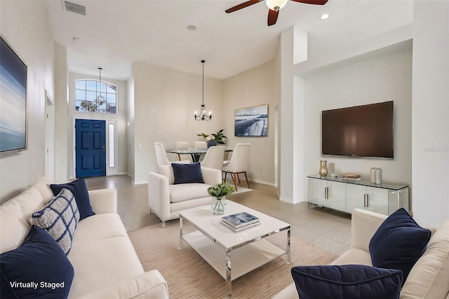 235 Royal Palm Dr, Davenport, FL 33837 - living room with a chandelier, a ceiling fan, light tile patterned floors, baseboards, and recessed lighting