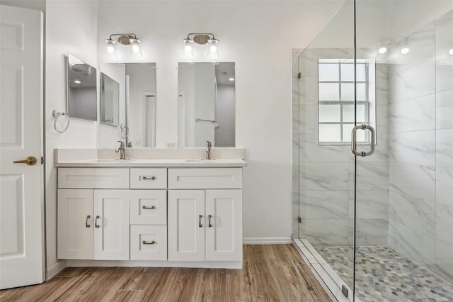235 Royal Palm Dr, Davenport, FL 33837 - bathroom featuring a shower stall, wood finished floors, and double vanity