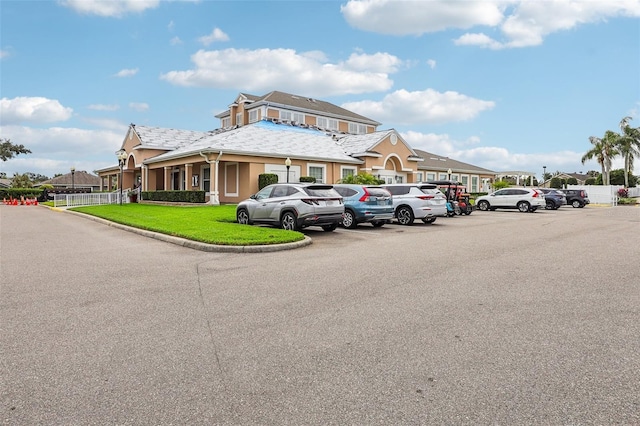 235 Royal Palm Dr, Davenport, FL 33837 - view of property featuring uncovered parking