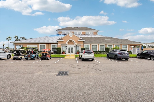 235 Royal Palm Dr, Davenport, FL 33837 - view of building exterior featuring uncovered parking
