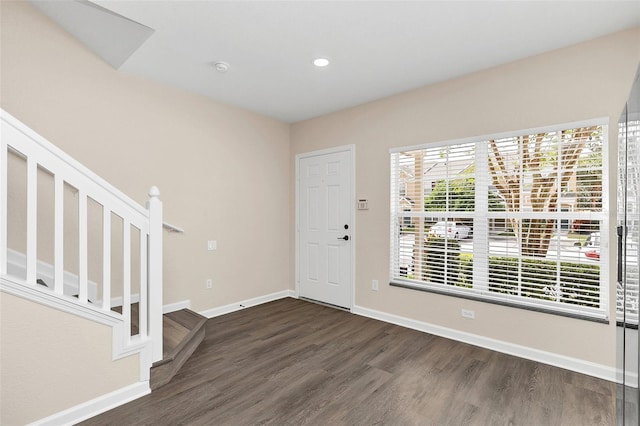 foyer entrance with dark wood-type flooring