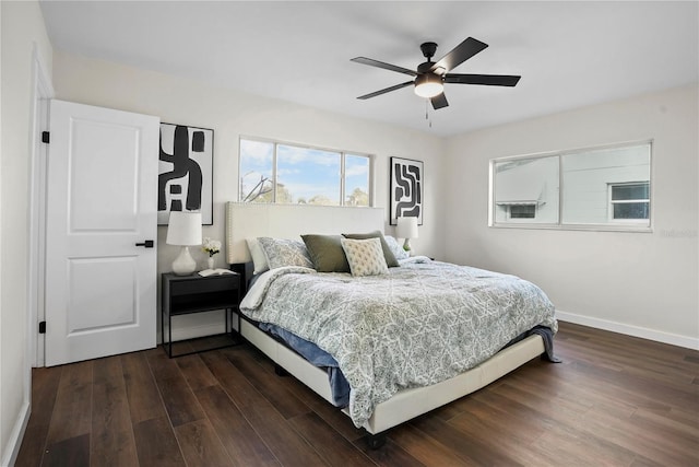 bedroom featuring dark hardwood / wood-style floors and ceiling fan