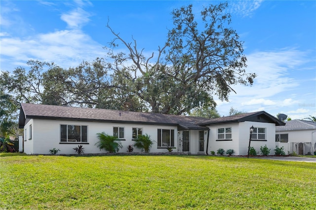 ranch-style house with a front yard