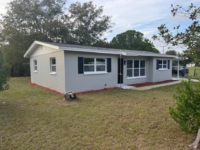 back of house with a yard