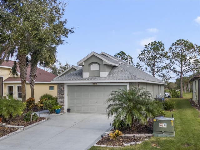 view of front of home featuring a garage and a front lawn