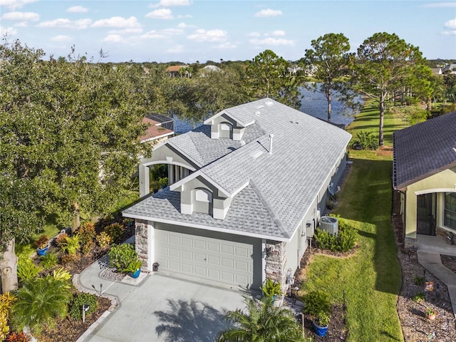 birds eye view of property with a water view