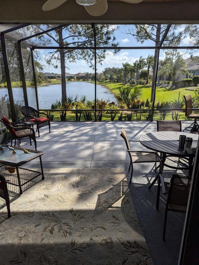 view of patio / terrace featuring a water view and a balcony