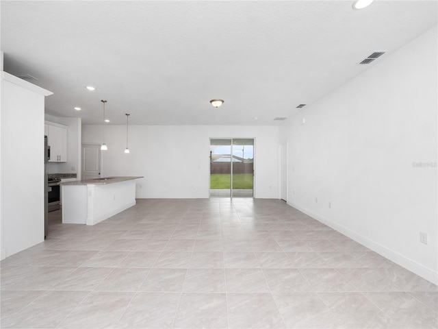 unfurnished living room featuring light tile patterned floors