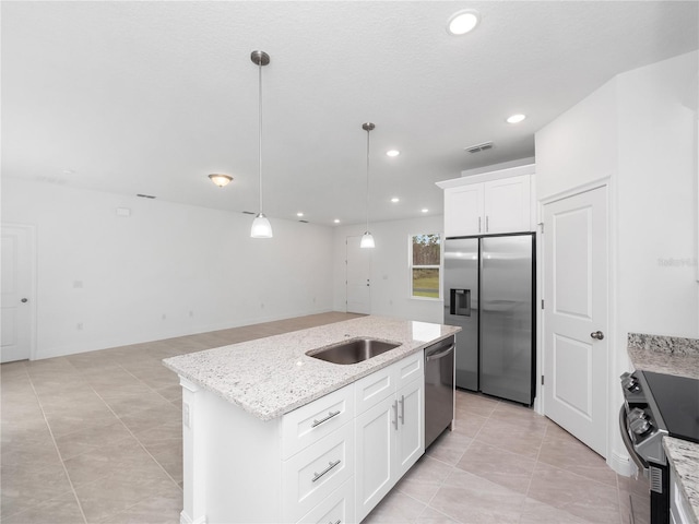 kitchen with white cabinetry, sink, a center island with sink, appliances with stainless steel finishes, and decorative light fixtures