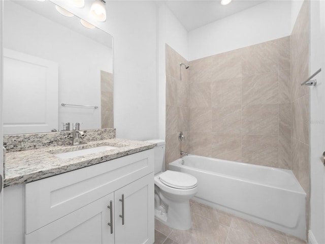 full bathroom featuring tile patterned floors, vanity, toilet, and tiled shower / bath