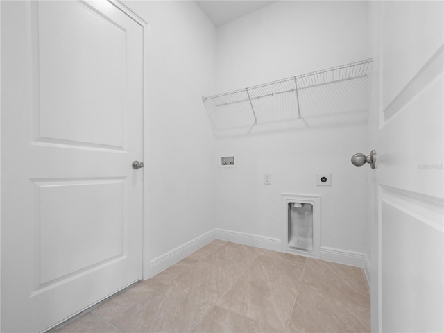 laundry area with light tile patterned floors, washer hookup, and hookup for an electric dryer