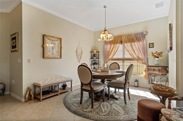 dining room featuring light tile patterned flooring, a chandelier, and ornamental molding