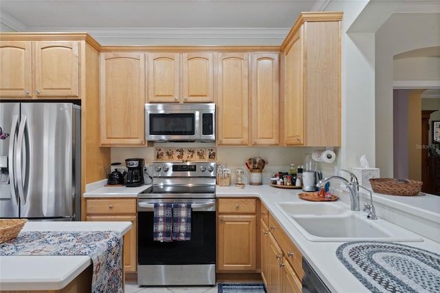 kitchen with appliances with stainless steel finishes, crown molding, sink, and light brown cabinets