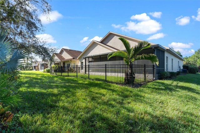 view of side of home featuring a yard