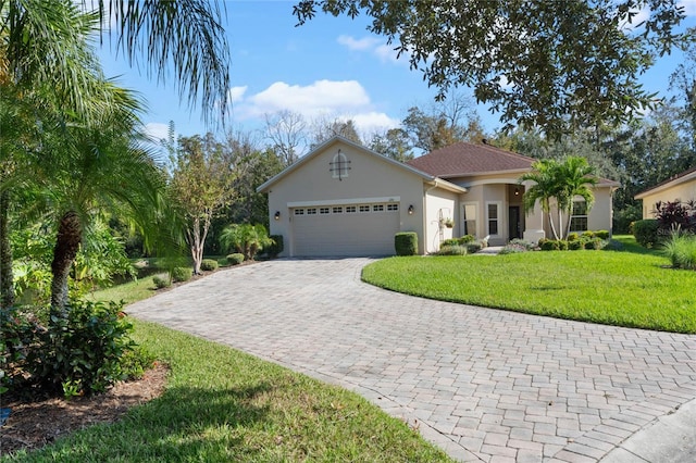 view of front of house with a front lawn and a garage