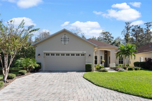 view of front facade featuring a front yard and a garage