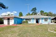 single story home featuring a front yard