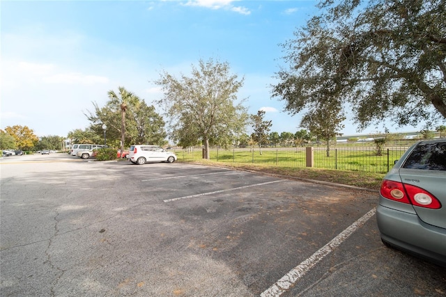 view of car parking featuring a yard