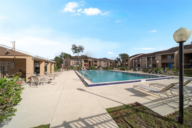 view of swimming pool with a patio