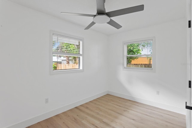 unfurnished room featuring light wood-type flooring and ceiling fan