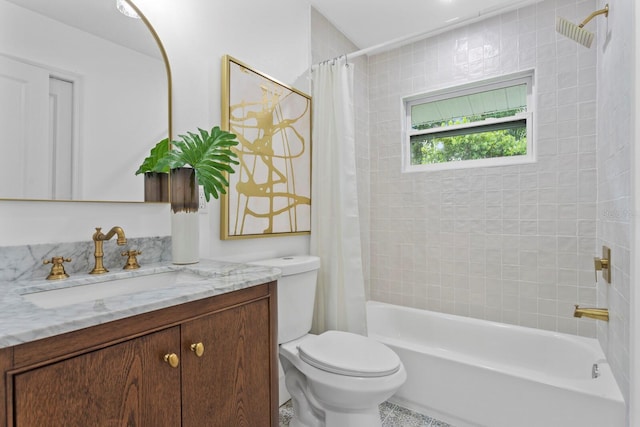 full bathroom featuring toilet, vanity, tile patterned flooring, and shower / bath combo with shower curtain