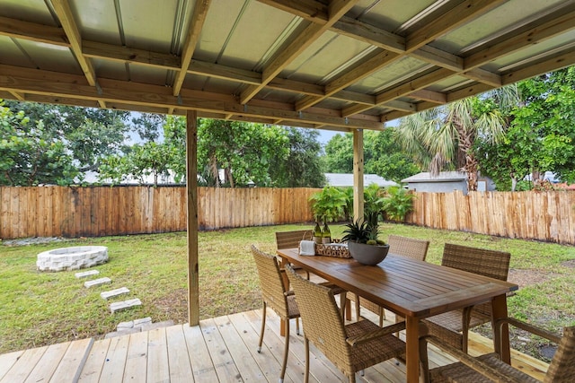 wooden deck with a lawn