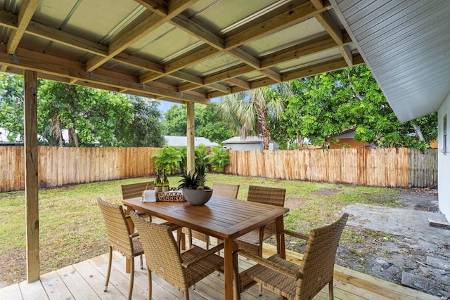 wooden deck with a lawn