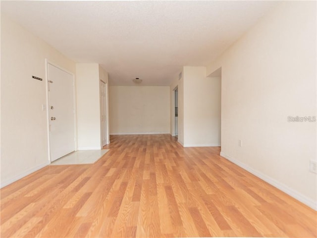 unfurnished room with light hardwood / wood-style flooring