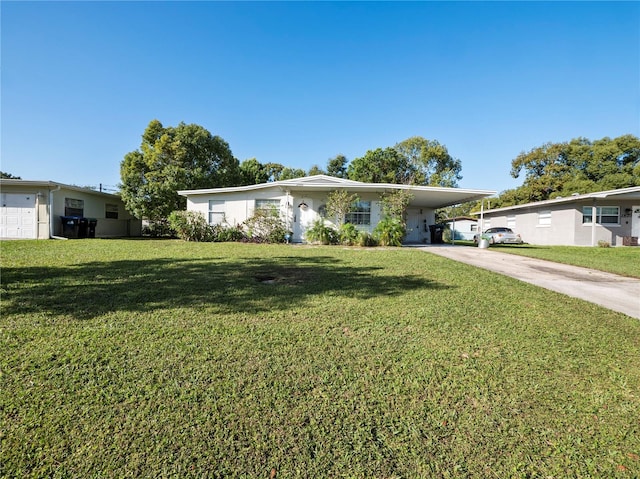 ranch-style house with a front yard and a carport