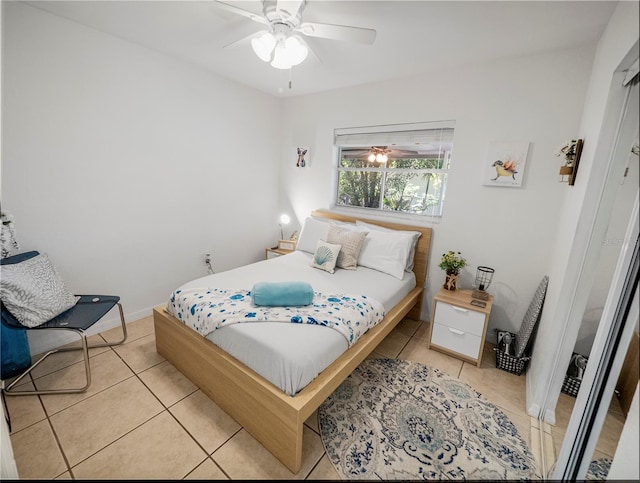 bedroom featuring ceiling fan and light tile patterned floors