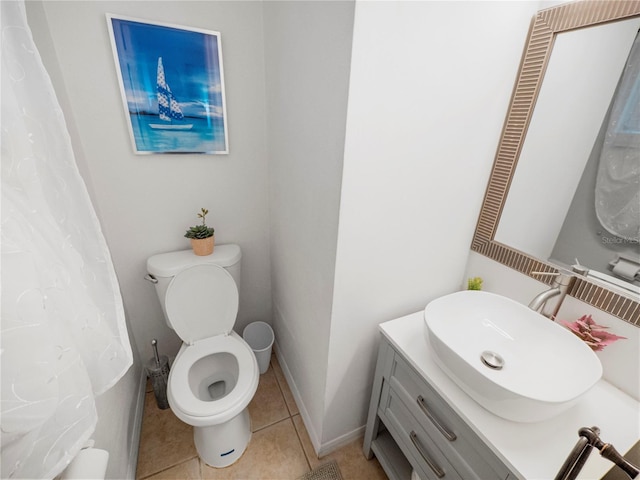 bathroom with tile patterned floors, vanity, and toilet