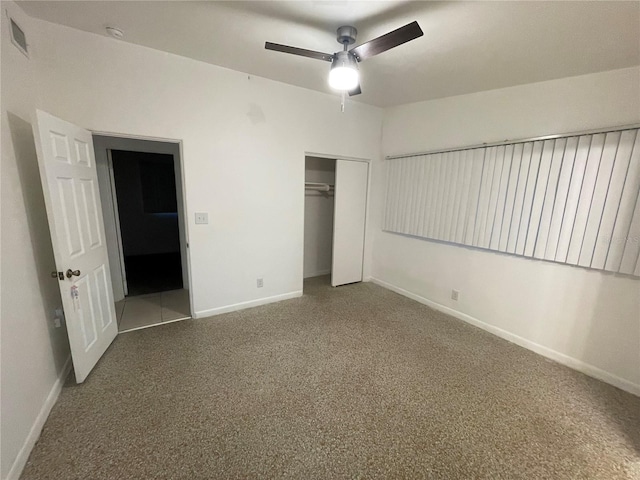 unfurnished bedroom with ceiling fan and a closet