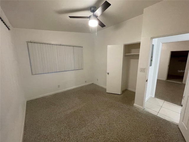 unfurnished bedroom with vaulted ceiling, light carpet, and ceiling fan