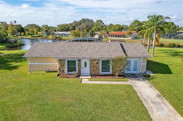 single story home featuring a water view and a front yard