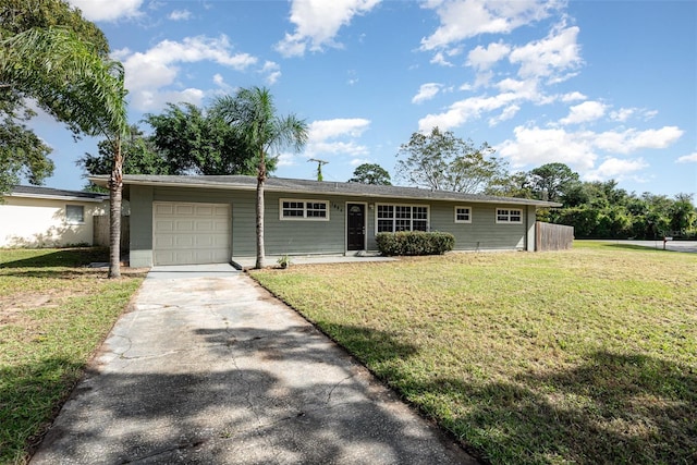 single story home with a garage and a front yard