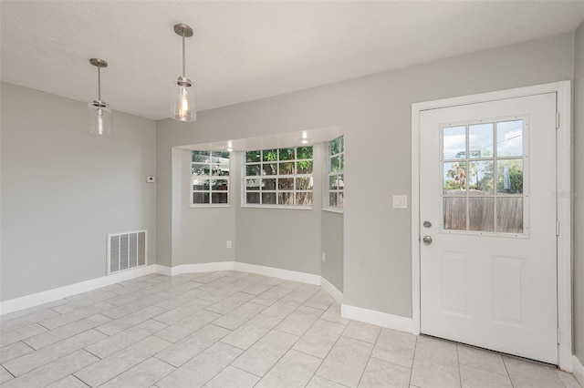 foyer with light tile patterned floors