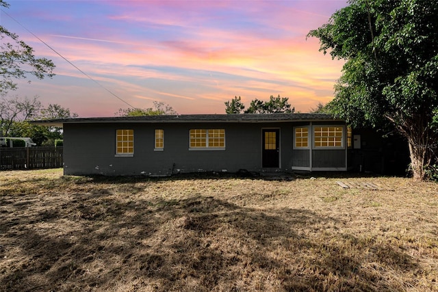 view of front of house with a yard