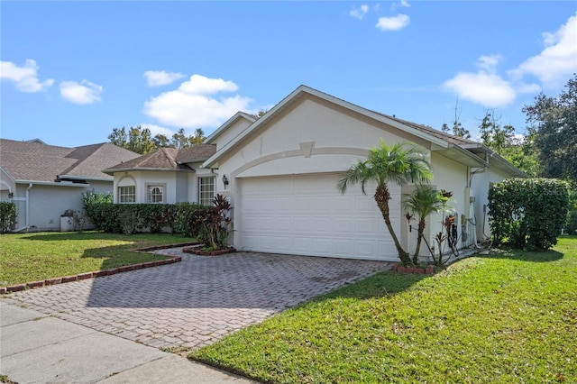 ranch-style house featuring a garage and a front lawn