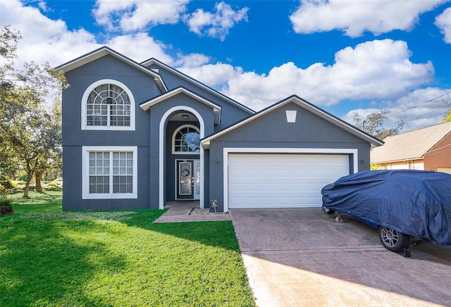 view of front of home featuring a garage and a front yard