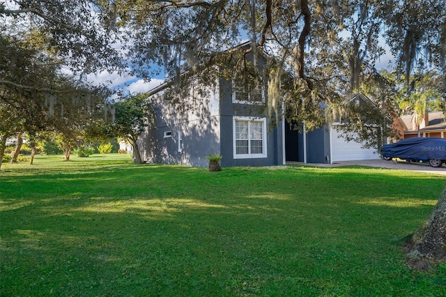 view of front of home with a garage and a front yard