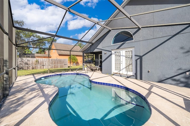 view of pool with a lanai and a patio