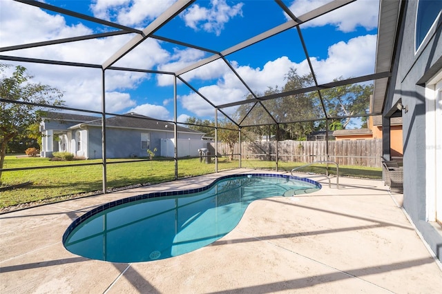 view of pool with a patio, a yard, and a lanai