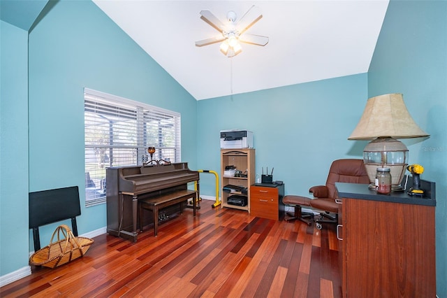 home office featuring dark hardwood / wood-style flooring, high vaulted ceiling, and ceiling fan