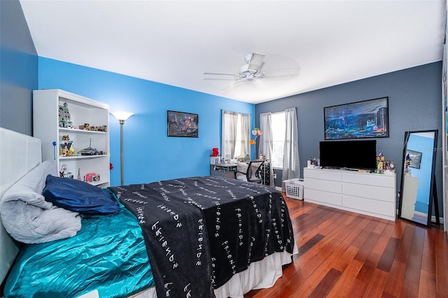 bedroom with hardwood / wood-style floors and ceiling fan