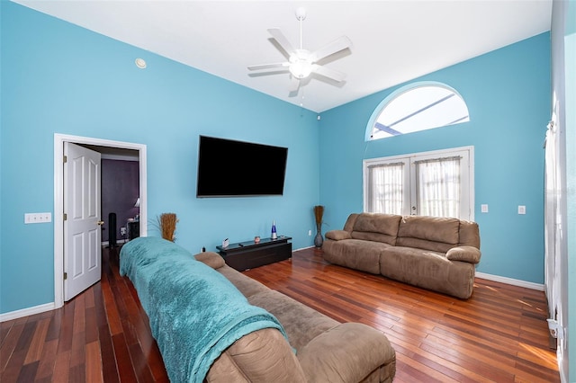 living room featuring dark wood-type flooring, ceiling fan, and french doors