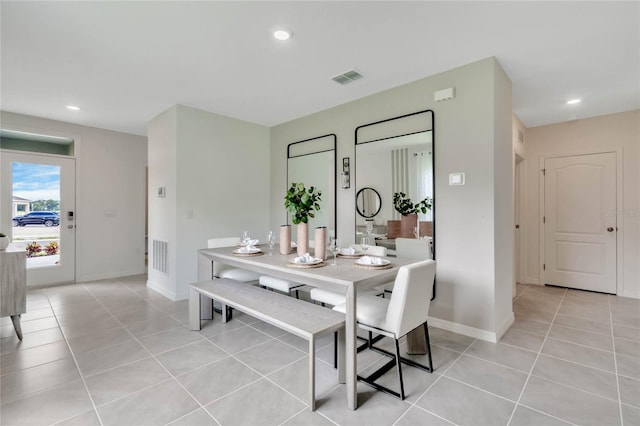 dining area with light tile patterned floors